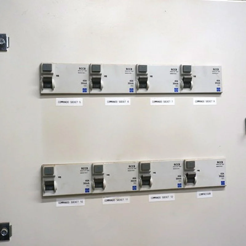Labelled isolator switches in two rows on a wall, from their gallery