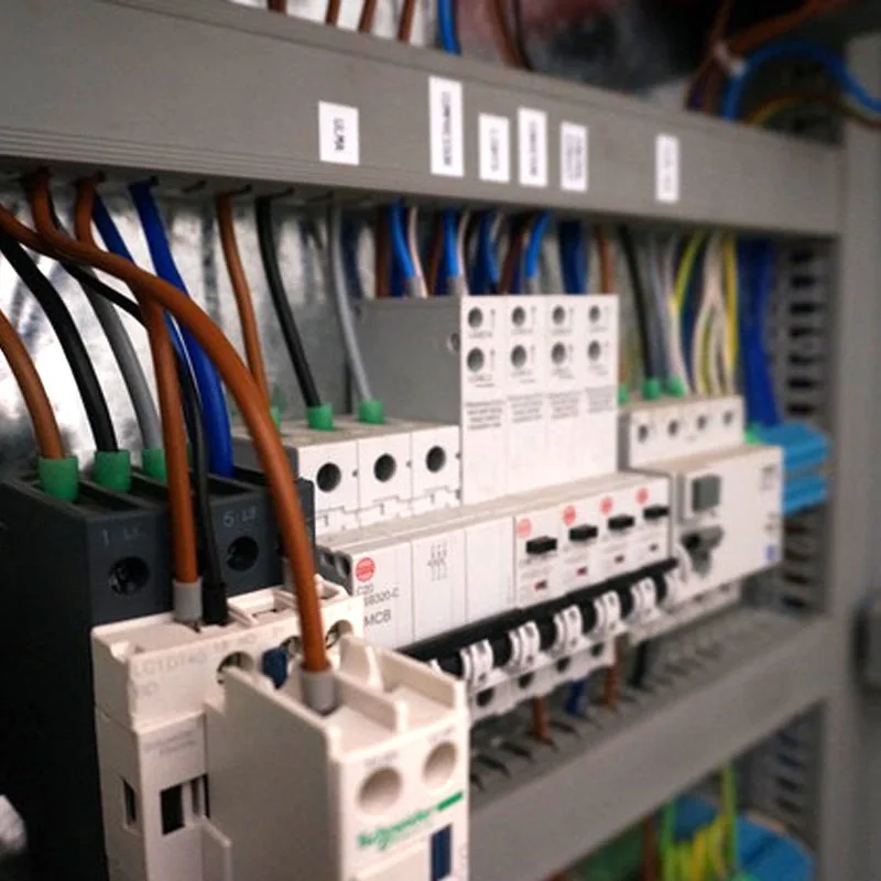Labelled breakers and terminals inside a control panel, from their gallery